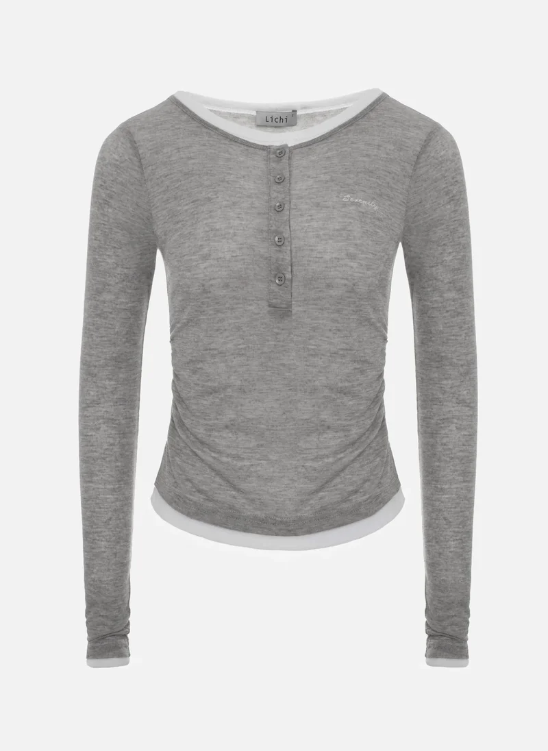 ليتشي أكمام طويلة مزدوجة مع أزرار على الياقة