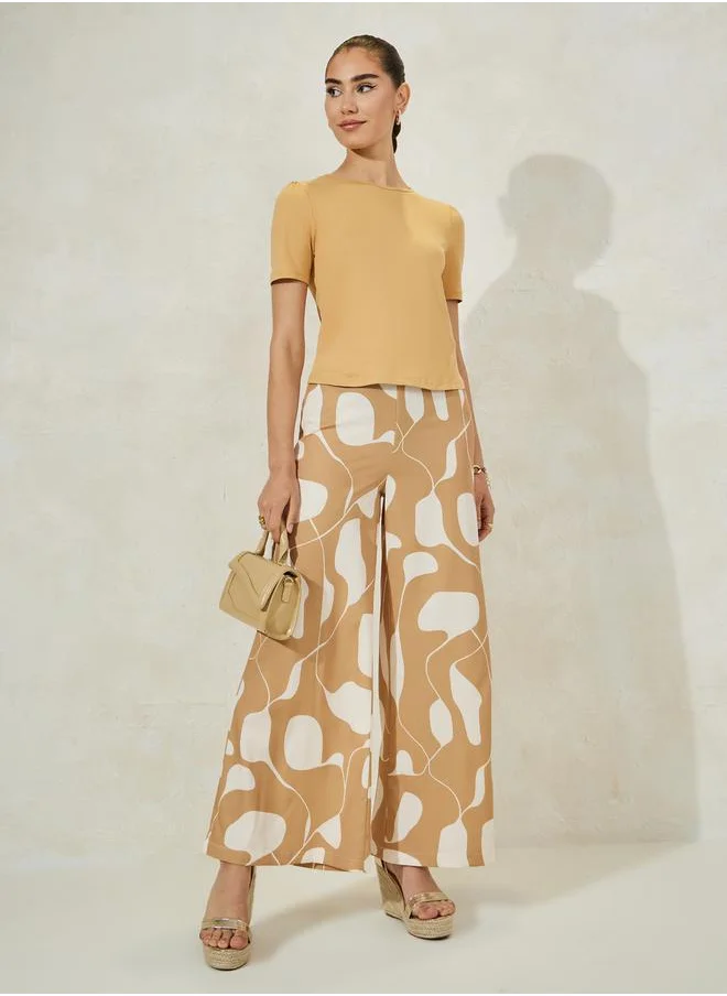 Styli Solid Knit Top & Printed Flared Pants Co-Ords