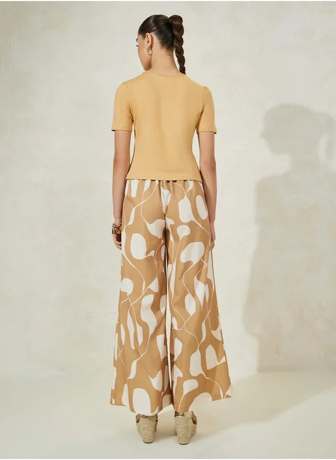 Styli Solid Knit Top & Printed Flared Pants Co-Ords