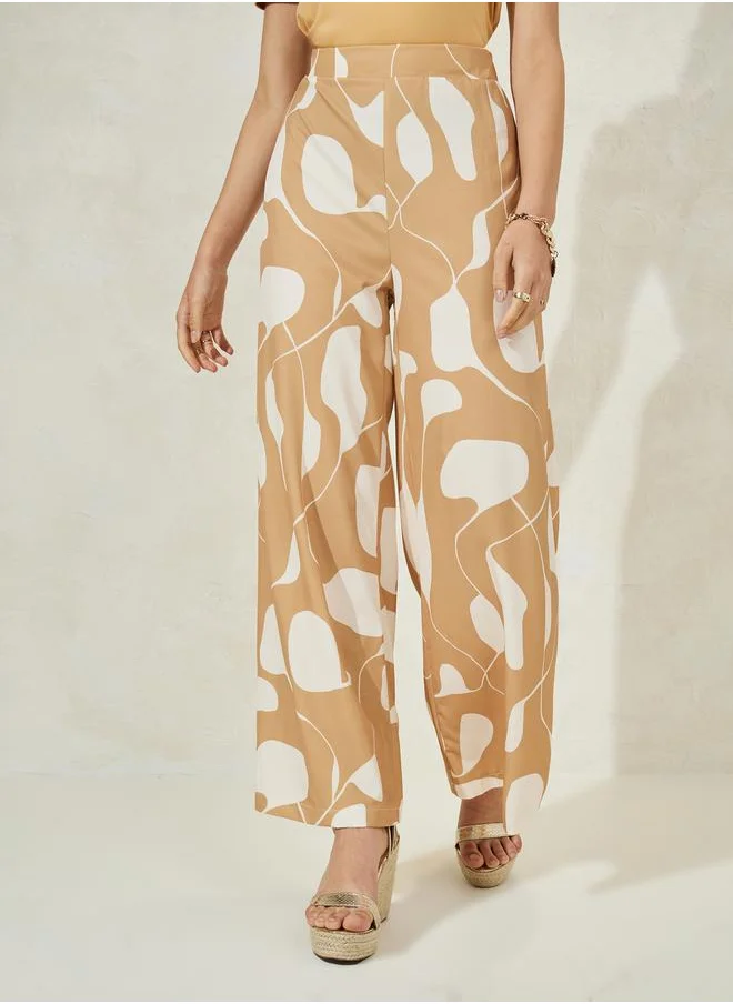 Styli Solid Knit Top & Printed Flared Pants Co-Ords