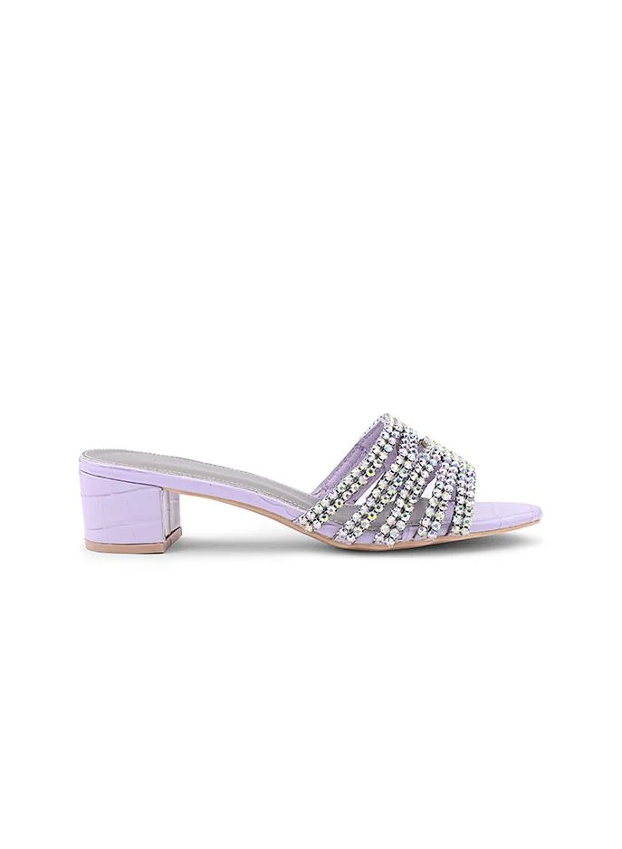 أيقون Crystal heel slipper with a refined finish.