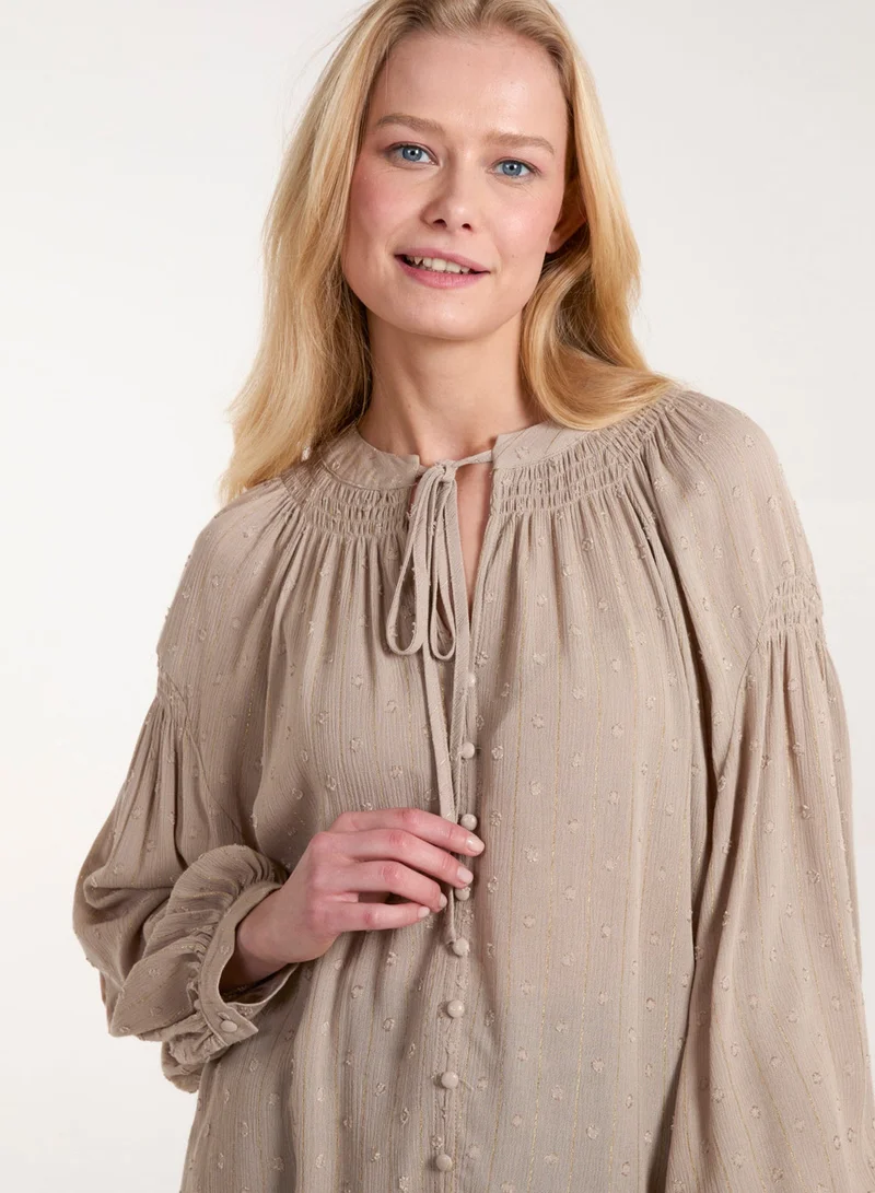 بلو فانيلا قميص بأزرار وأكمام طويلة وربطة أمامية