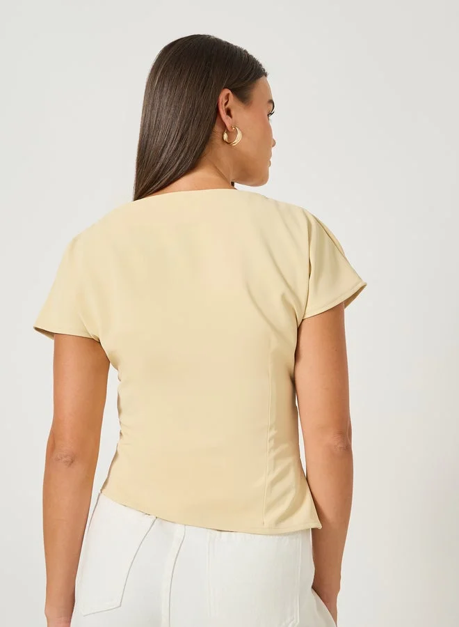 Styli Beige Solid Pleated Asymmetric Hem Sleeveless Top for Women | Best Price UAE
