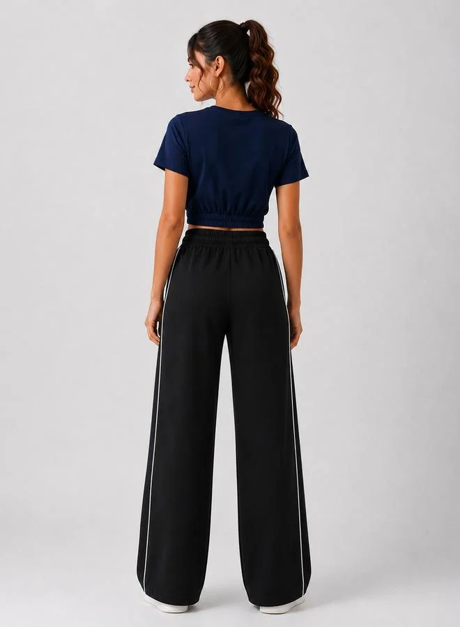 تايك تو Black High Rise Contrast Piping Wide Leg Joggers By Gravt