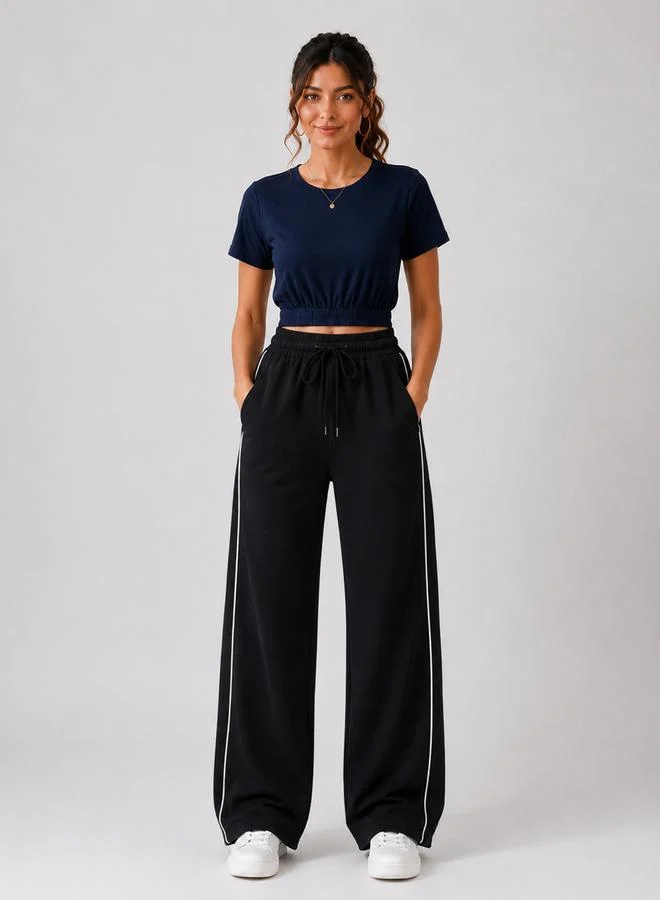 تايك تو Black High Rise Contrast Piping Wide Leg Joggers By Gravt