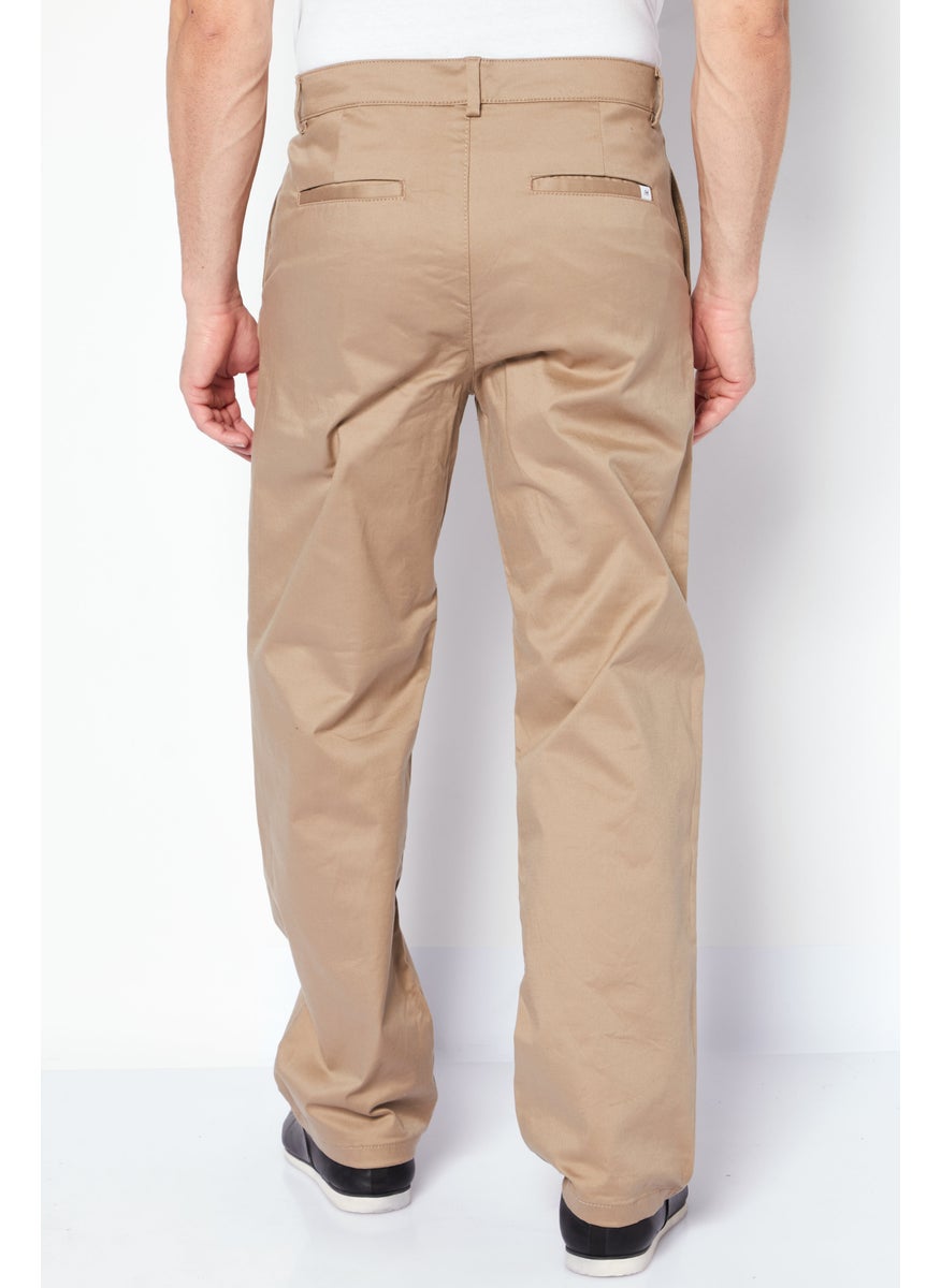 Men Loose Fit Solid Chino Pants, Tan - pzsku/Z8703441B5BDC62C30F07Z/45/_/1724350889/fb7b21fe-6ed3-44ba-b6c6-618c084fd601