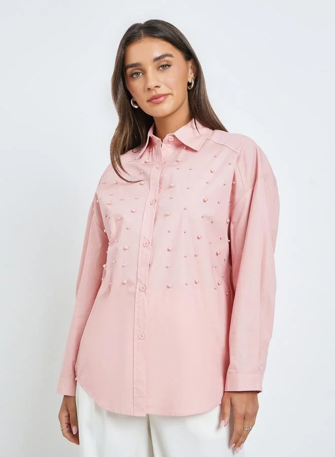 ستايلي قميص بقصة مريحة مزينة باللؤلؤ