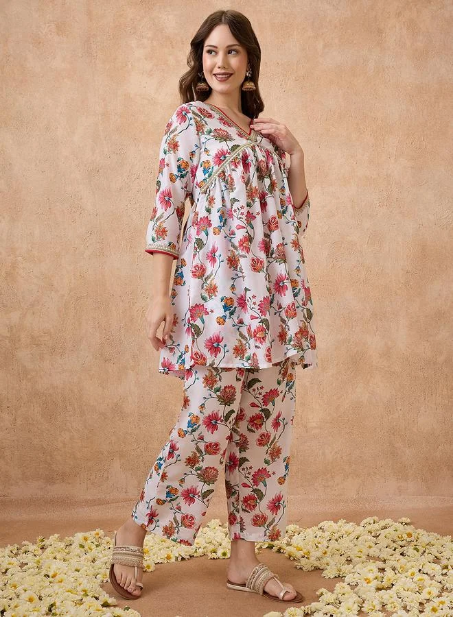 جلو باص طقم منسق من بنطال مع بلوزة تونيك بطبعة زهور