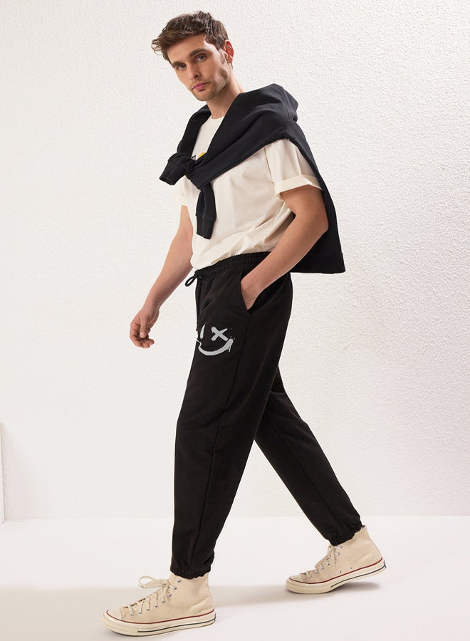 trendyol Black Oversize/Wide Cut Elastic Leg Smiley Face Printed Jogger Sweatpants - Image 1