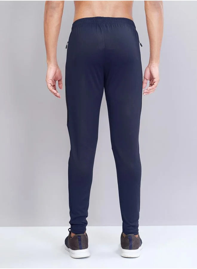 تكنوسبورت Men Solid Slim Fit Track Pants with TECHNO DRY by Styli