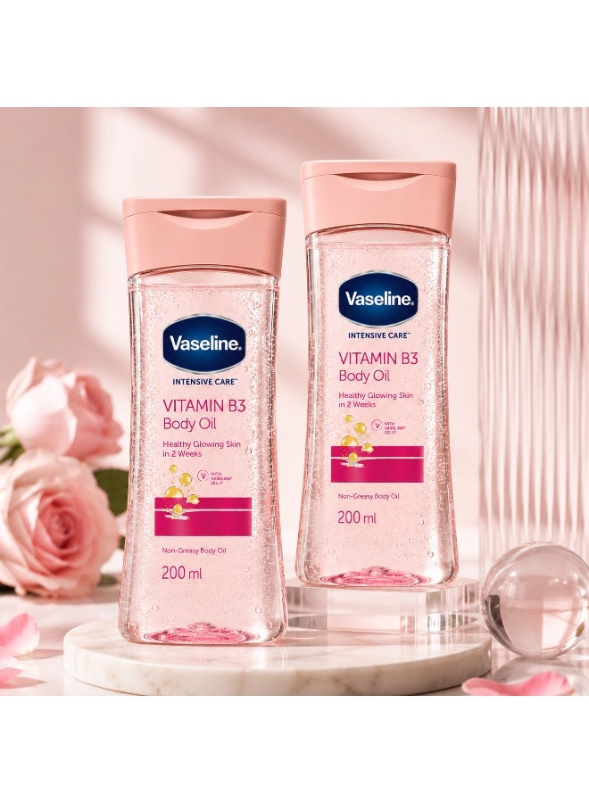 فازلين زيت الجسم "فازلين إنتنسيف كير" (Vaseline Intensive Care) بفيتامين B3 - زيت مرطب خفيف الوزن لبشرة صحية ومشرقة، تركيبة غير دهنية، 200 مل للعبوة الواحدة، عبوة مزدوجة (قطعتان) - Image 2