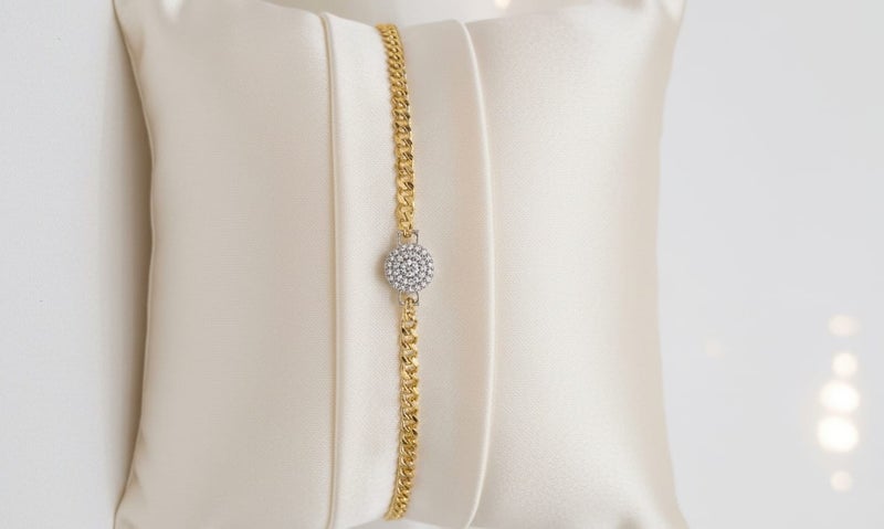 A flowing, thick gold-plated chain design with a circle pendant and a shiny silver-plated center - with additional links for adjusting the size. - Image 4