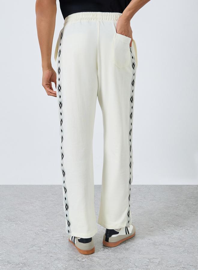 ستايلي بنطال جوغر واسع من تيري بتفاصيل شريط بوهيمي - Image 4