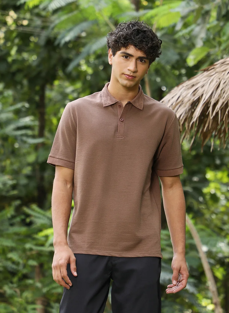 Campus Sutra Campus Sutra Men Seersucker-Jacquard Polo T-Shirt | Jacquard Polo Neck Short Cuffed Sleeves | Half-Button Closure Straight Hem | Solid Jacquard | Knitted Fabric For Casual & Daily Wear | Ash Brown