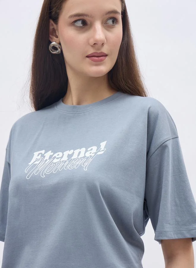 Styli Women Blue Slogan Print Short Sleeve Oversized T-Shirt