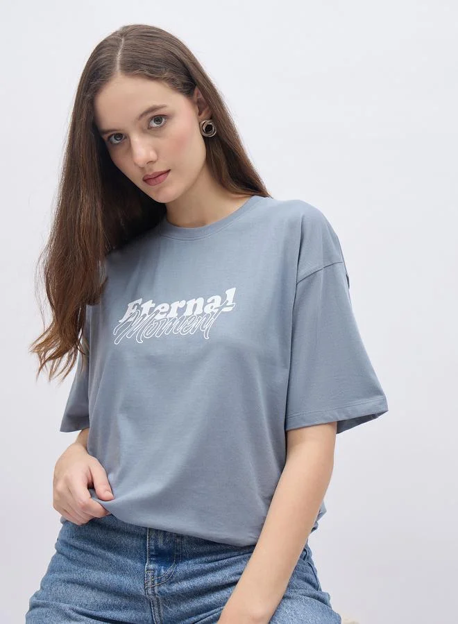 Styli Women Blue Slogan Print Short Sleeve Oversized T-Shirt