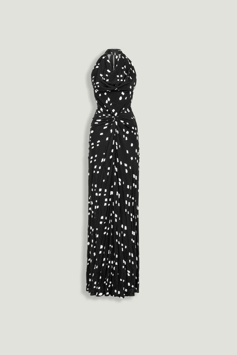 نوكتورن A fluid halter-neck maxi dress featuring an all-over abstract print and soft draping that flatters the silhouette. Designed to move effortlessly with the body, making it ideal for evening events or summer occasions.– True to size– Halter neckline with open back– Soft draped detailing at the front– Lightweight, fluid fabric with all-over print– Model is 5'11" (180 cm) tall with a 32.5" bust, 24.5" waist, and 36" hips, wearing a size S