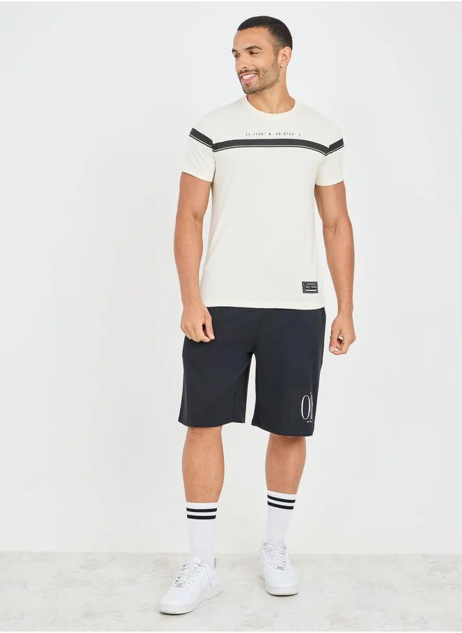 Styli Styli Contrast Panel Slogan Print Regular Fit T-Shirt with Badge Detail