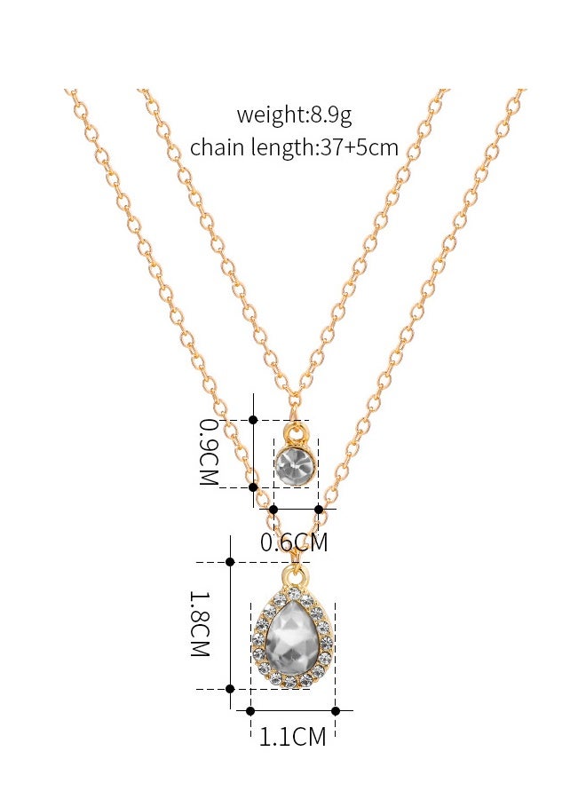قلادة بوهيمية  لحفل زفاف ذات طبقات متعددة بأحجار سيز  الصغيرة – باللونين الفضي والأصفر الذهبي – متوهجة. قلادة مع رمز مضيء على شكل دمعة من الكريستال الصغيرة والناعمة، وبرمز دائري صغير ذو نقاط، ومؤخرة من الريهستون . شريطرقبة  بسيطة ذو سلسلة رفيعة، ناعمة ومُبسطَة  مصممة للمرأة. - Image 3