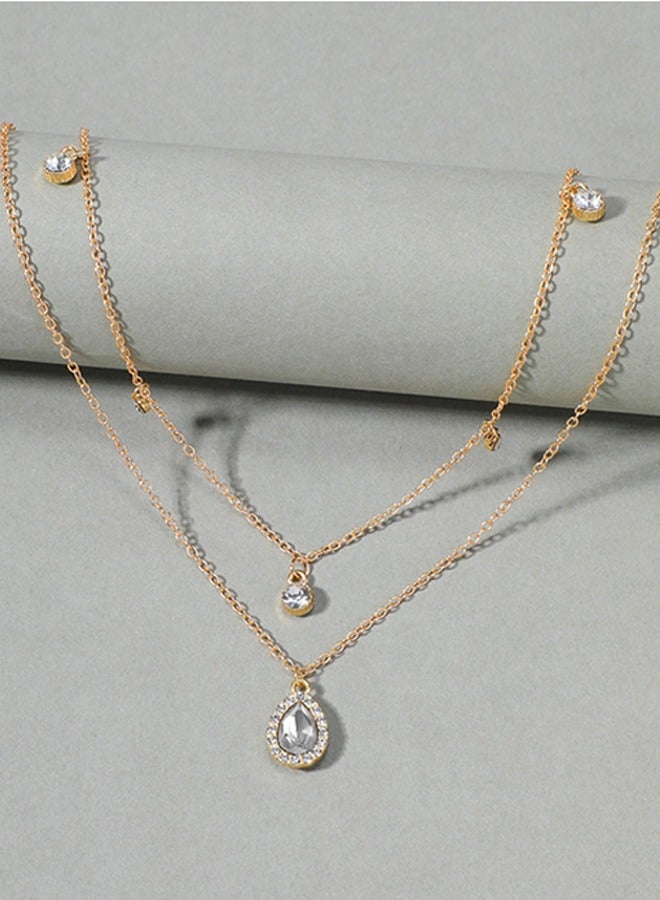 قلادة بوهيمية  لحفل زفاف ذات طبقات متعددة بأحجار سيز  الصغيرة – باللونين الفضي والأصفر الذهبي – متوهجة. قلادة مع رمز مضيء على شكل دمعة من الكريستال الصغيرة والناعمة، وبرمز دائري صغير ذو نقاط، ومؤخرة من الريهستون . شريطرقبة  بسيطة ذو سلسلة رفيعة، ناعمة ومُبسطَة  مصممة للمرأة. - Image 5