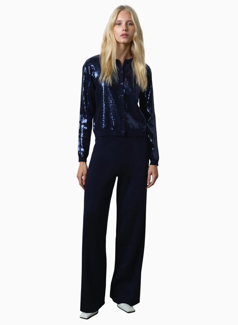 فرنش كونكشن بلوزة بأكمام طويلة مزينة بالترتر بأزرار من هانا