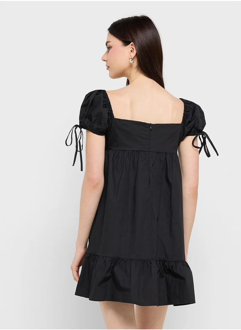 جينجر Ruffle Hem Mini Dress