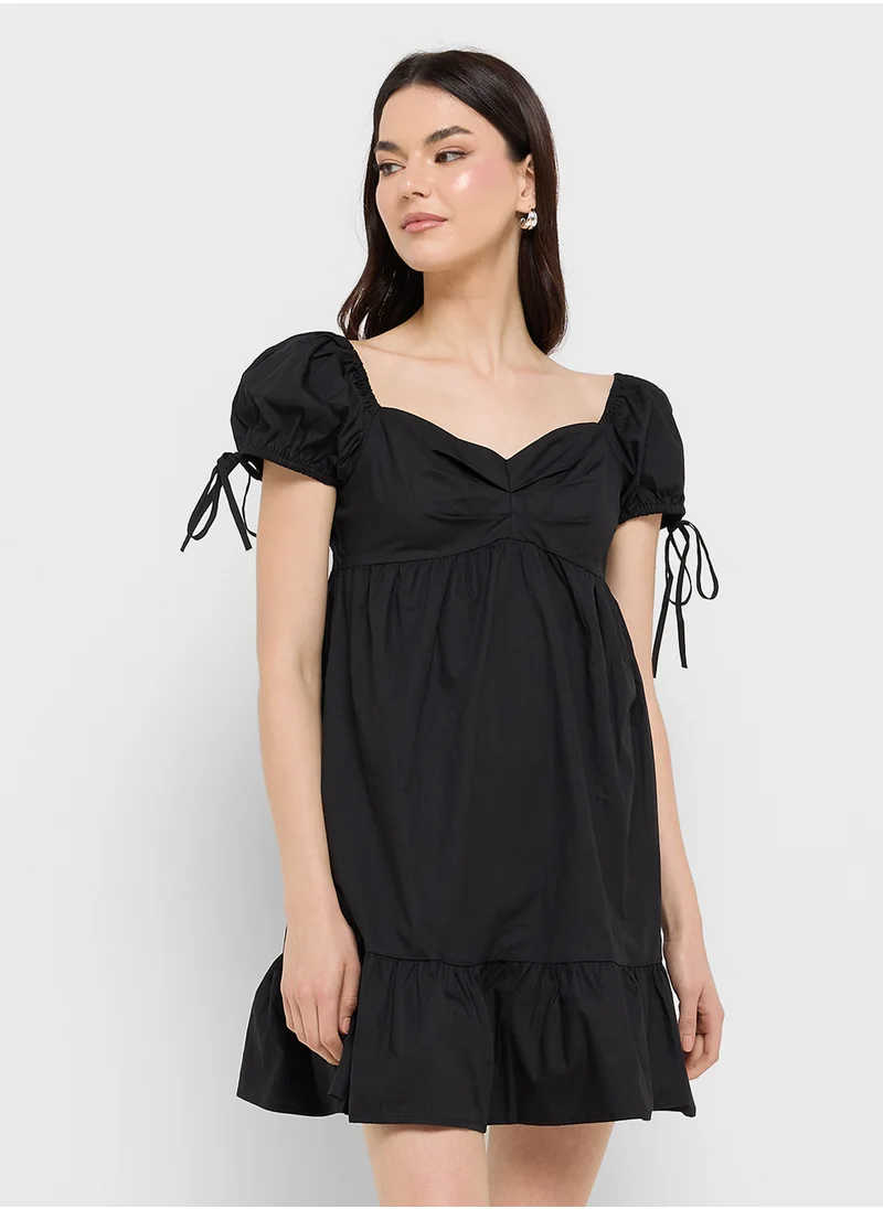 جينجر Ruffle Hem Mini Dress