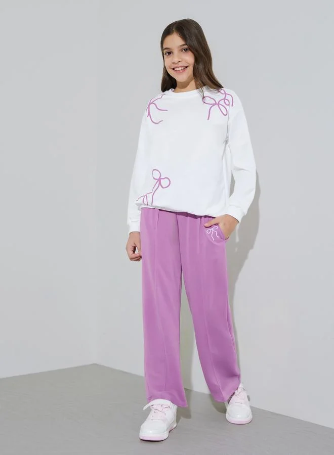 Styli Teen Girls Off White Bow Print Sweatshirt and Purple Pintuck Straight Leg Pants Set