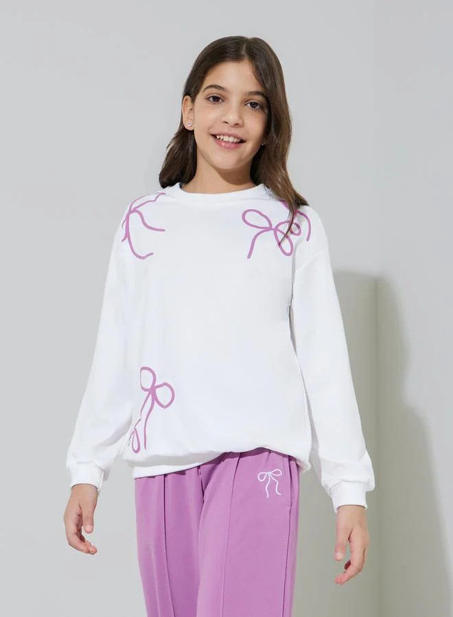 Styli Teen Girls Off White Bow Print Sweatshirt and Purple Pintuck Straight Leg Pants Set