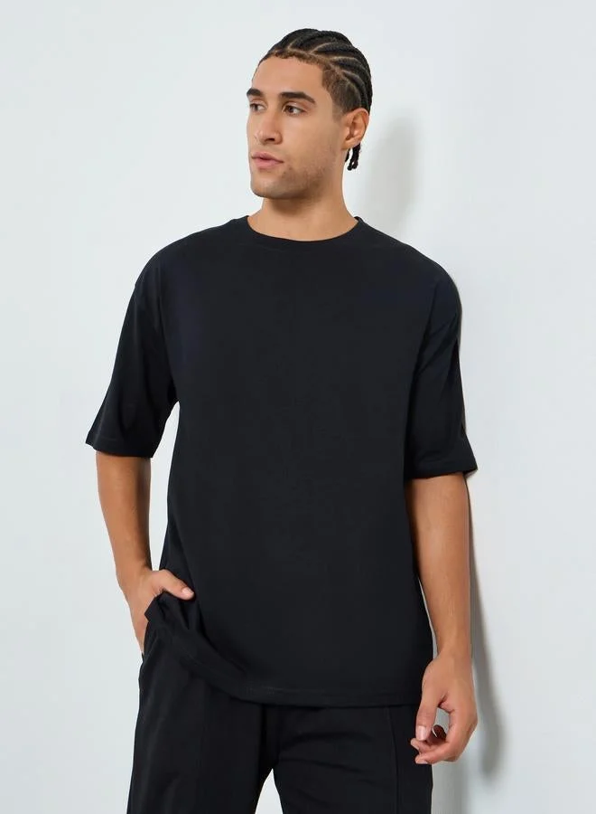Styli Men Black Oversized Tennis Graphic Jersey T-Shirt