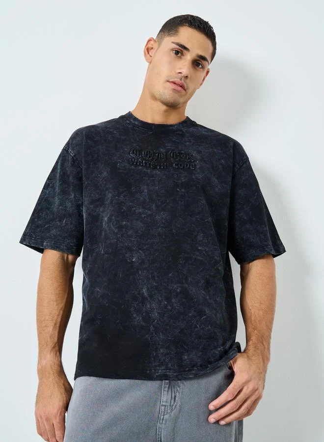 Styli  Styli Acid Wash Oversized Terry T-Shirt with Embossed Print for Men | Best Price UAE