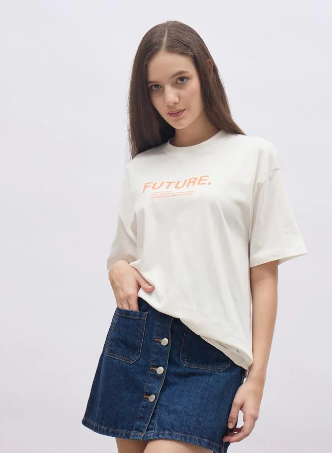 ستايلي Styli Women Cream Slogan Print Short Sleeve Oversized T-Shirt
