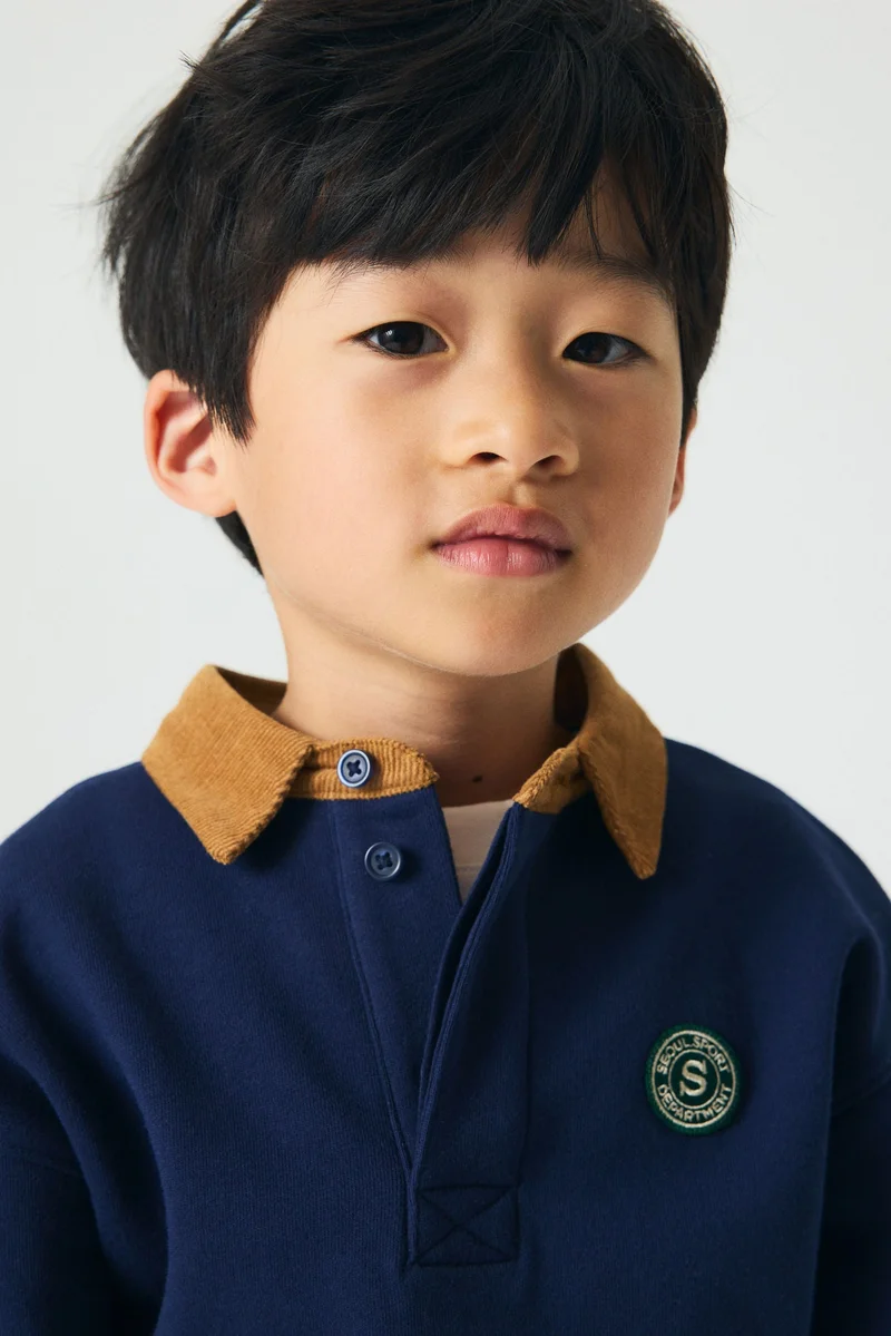 اتش اند ام قميص رغبي بقصّة فضفاضة