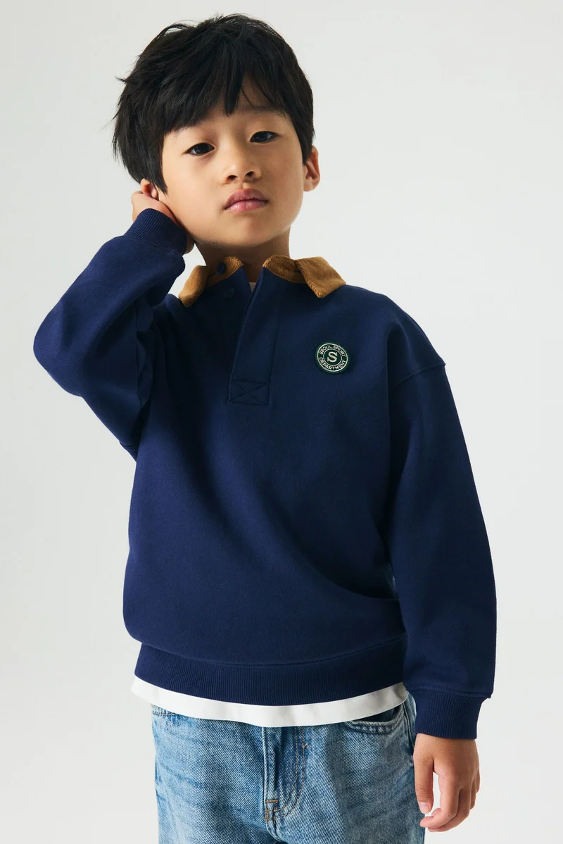 اتش اند ام قميص رغبي بقصّة فضفاضة