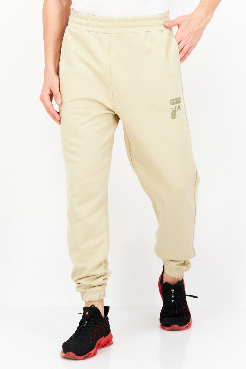 FILA Men Relaxed Fit Badra Drawstring Outdoor Sweatpants, Khaki  - Image 1