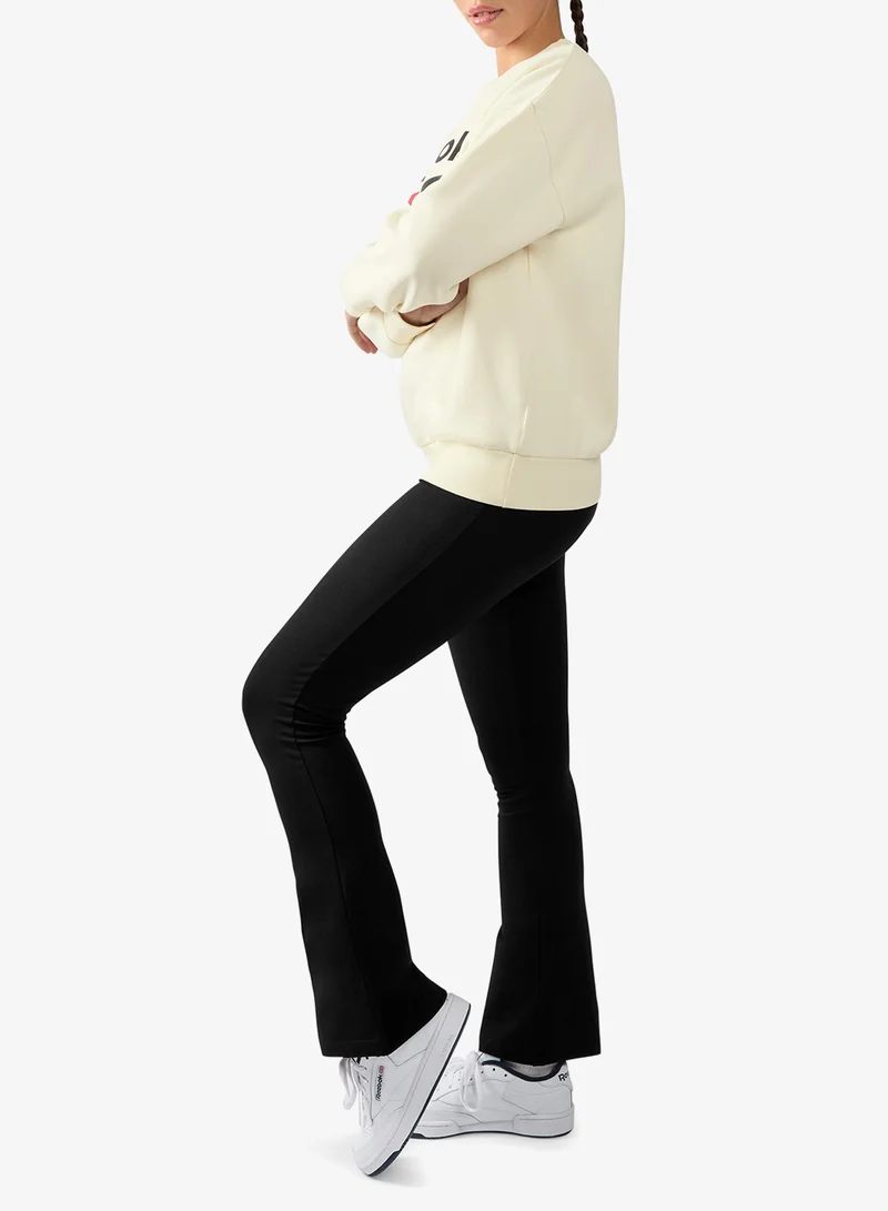 Reebok  Tara Small Logo Flared Leggings for Women | Best Price UAE