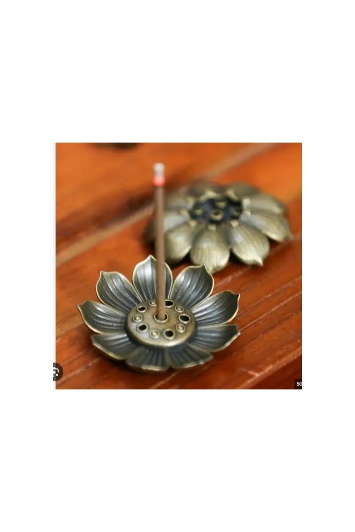 "An elegant and luxurious metal incense burner with artistic engravings.  " 