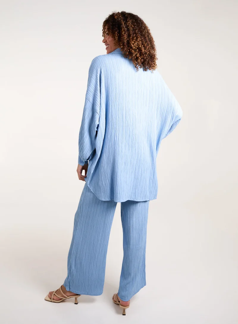 بلو فانيلا طقم قميص وبنطلون وافل