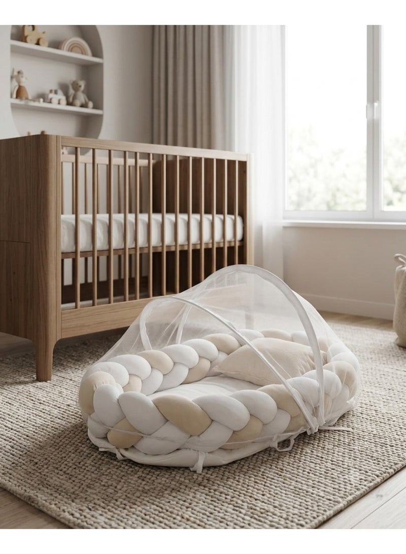 StarKids A portable newborn bed featuring a cozy nest design, a braided protective bumper, and a detachable, built-in mosquito net, ensuring a peaceful, safe, and comfortable sleeping environment for your baby—anytime, anywhere. - Image 1