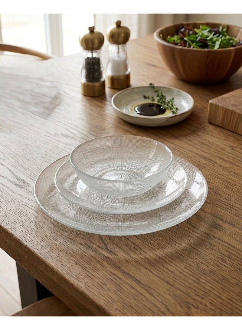 This 3-piece clear glass dinnerware set features a modern and elegant design. - Image 1