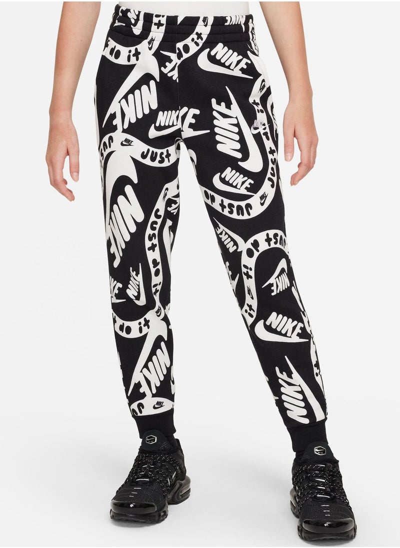 Nike - Kids Club Fleece All Over Printed Joggers - Image 1