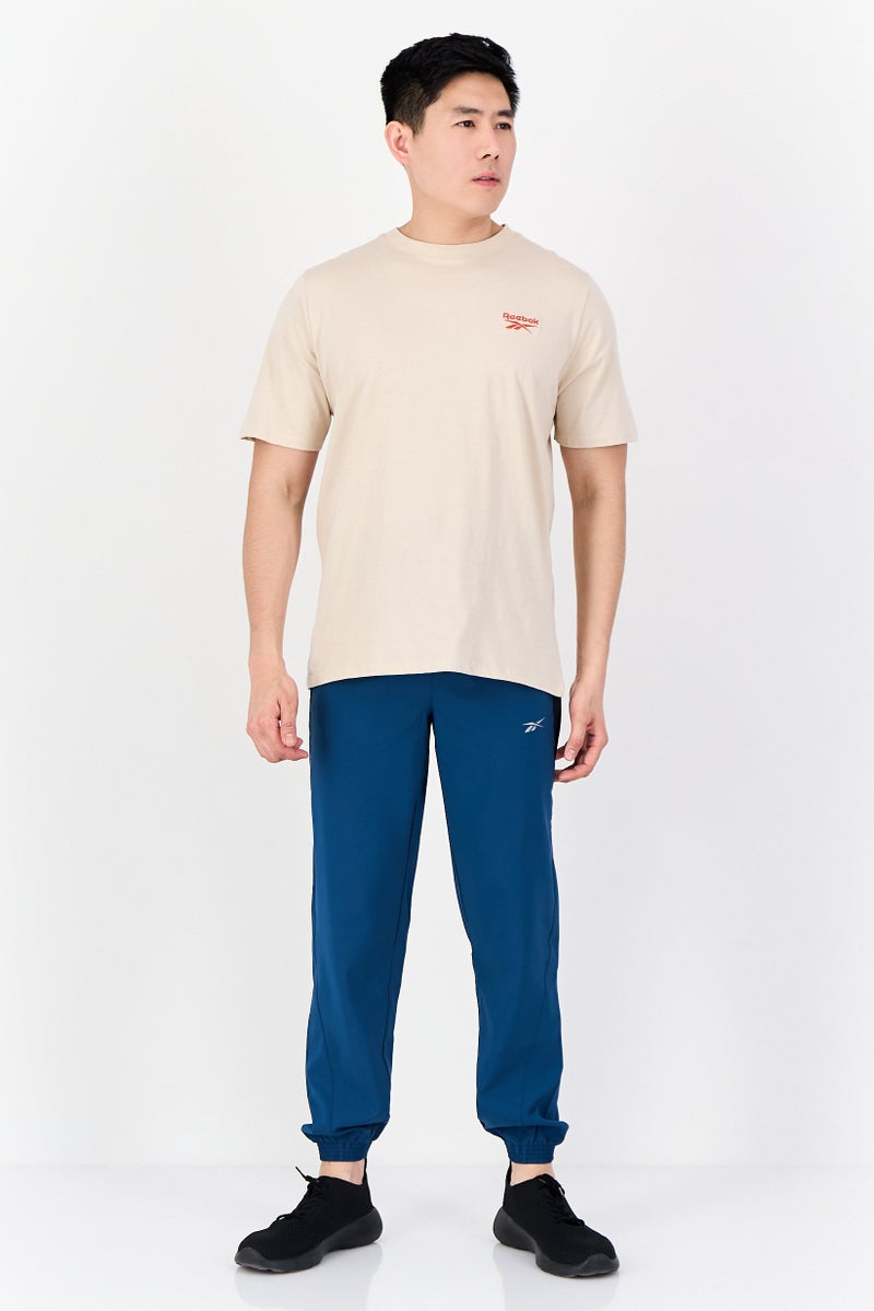 Reebok تي شيرت رياضي للرجال بأكمام قصيرة مناسب في الهواء الطلق، بيج - Image 4