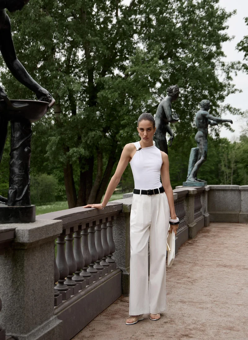 Lichi Top with asymmetrical straps and metal decorations