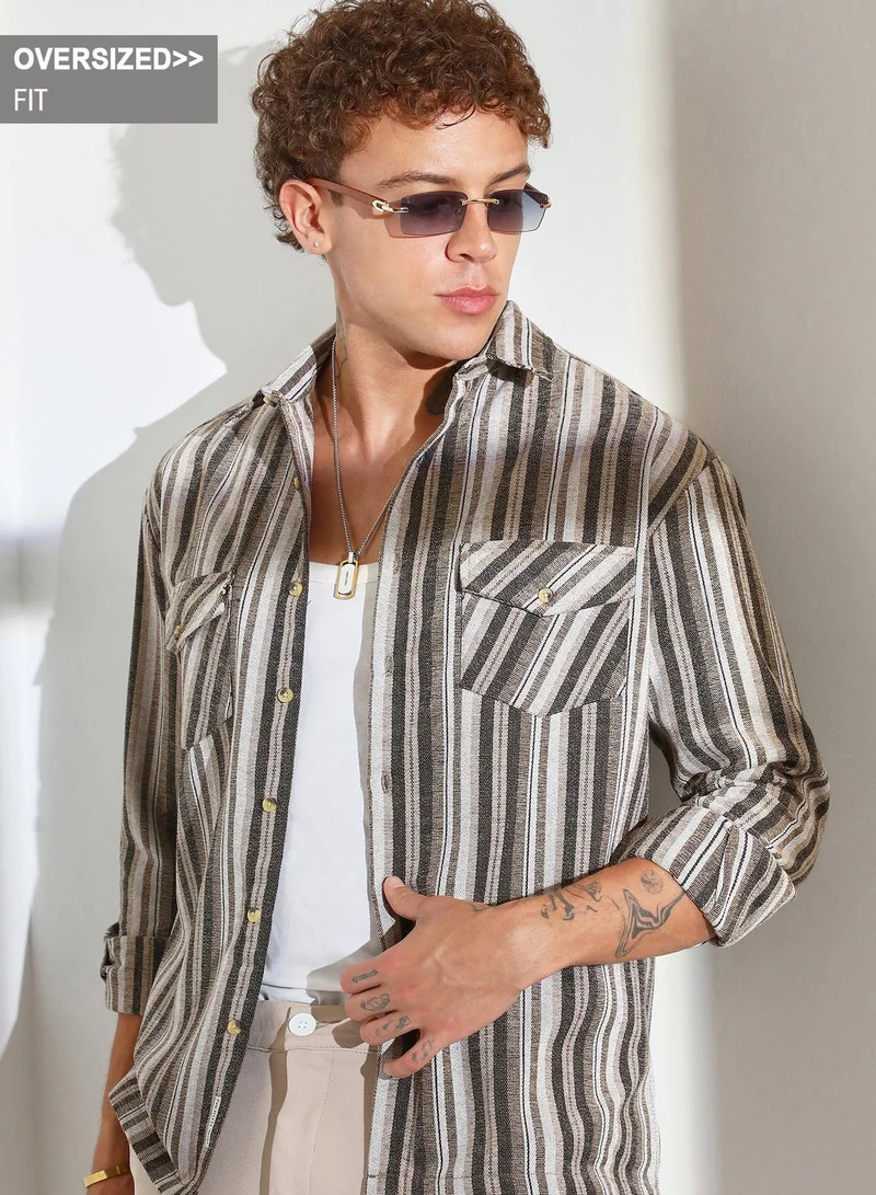 Campus Sutra Campus Sutra Men's Brown Multitrack Striped Oversized Shirt For Casual Wear | Spread Collar | Long Sleeve | Button Closure | Oversized Shirt Crafted With Comfort Fit For Everyday Wear