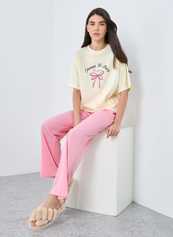 Styli Paris Bow Graphic Drop Shoulder T-Shirt and Pyjama Set - Image 1
