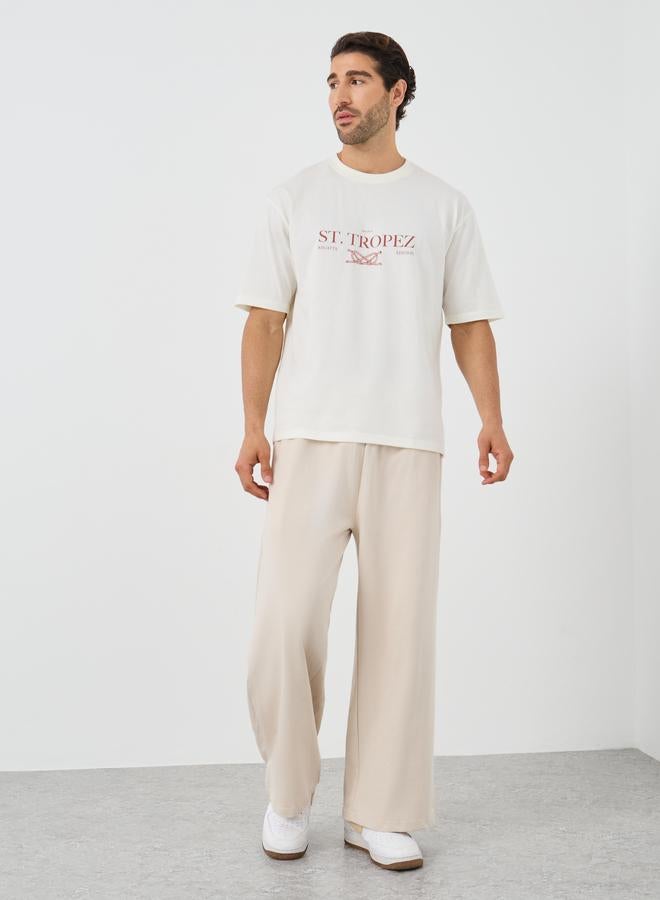 ستايلي تيشيرت ستايلي بطبعة شعار، بياقة دائرية، مقاس واسع - Image 2