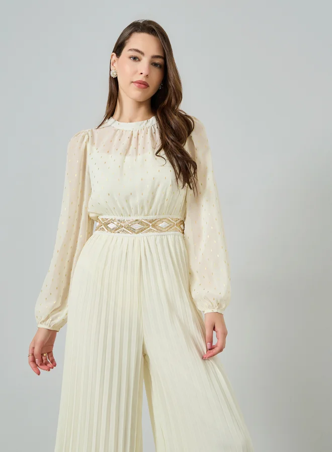 ستايلي جمبسوت بكسرات وأرجل واسعة مع تفاصيل لوريكس