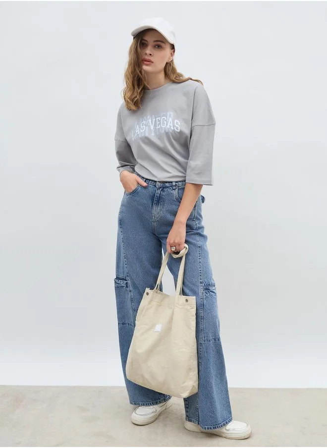 ستايلي Styli Exaggerated Shoulder Slogan Print Oversized T-Shirt