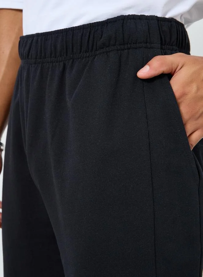 Styli  Men Black Terry Joggers with Embossed Detail for Men | Best Price UAE