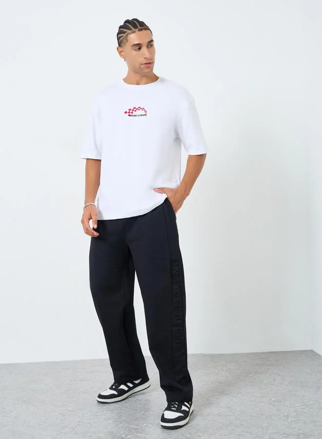 Styli Men Black Terry Joggers with Embossed Detail